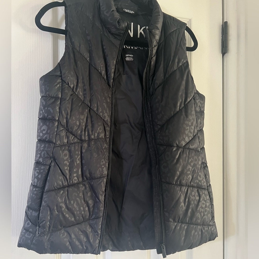 like new calvin klein black vest with leopard pattern!